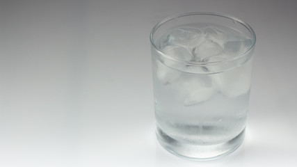 ice in a glass on a gray background