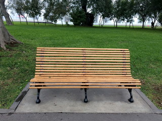 Wooden chair on green park or garden background