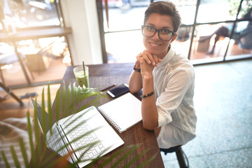 Girl working in a cafe. Freelance concept                   