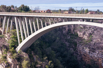 Fototapeta na wymiar Bridge structure over narrow gauge in valley