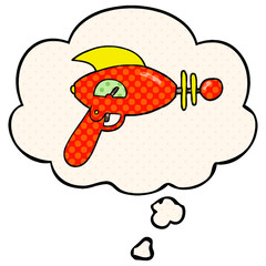 cartoon ray gun and thought bubble in comic book style