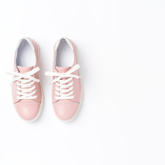 Pink sneakers on white background