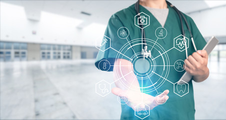 young doctor with hospital background