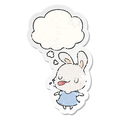 cartoon rabbit and thought bubble as a distressed worn sticker