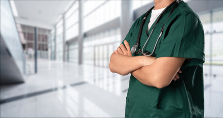 young doctor with hospital background