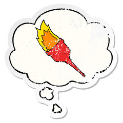 cartoon flaming torch and thought bubble as a distressed worn sticker