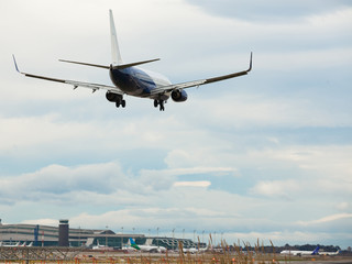 Fototapeta na wymiar modern passenger plane lands at airport