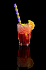 Red cocktail with orange slice, summer cold drink over black background