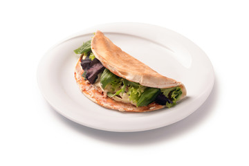 romagnola piadina on a plate, isolated on white background