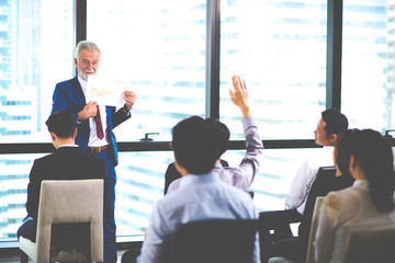 Business Team work concept. Modern businessman explaining his ideas to colleagues at seminar