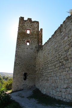 Ruins of the Genoese fortress in the city of Feodosia in the Crimea in the autumn under the open sky. Architecture, history, travel and tourism concept.
