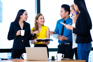 Business Team work concept. Modern businessman explaining his ideas to colleagues at seminar