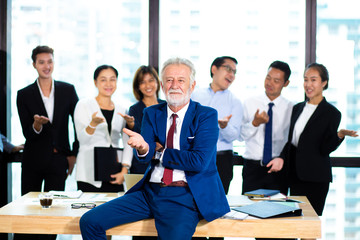 business teamwork concept. Group of business people with businessman leader on foreground