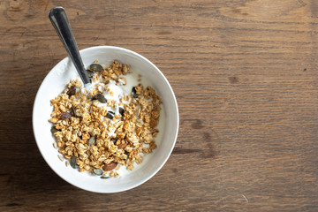 oatmeal granola with peanuts, with cup off coffee