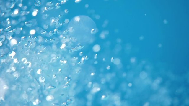 Bubbles rising. Air bubbles in water in sea (underwater shot), good for backgrounds. Slow motion.