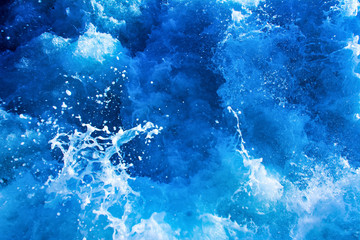 Fototapeta na wymiar turbulent and splashing sea water, blue color