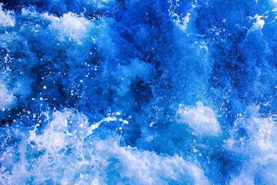 turbulent and splashing sea water, blue color