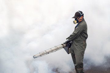 The man's fogging to eliminate mosquito for preventing spread dengue fever and zika virus