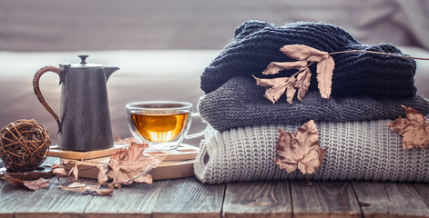 Cozy autumn still life with a cup of tea
