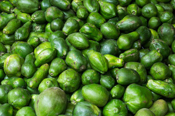 green pawpaws at the market