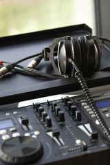 Fototapeta na wymiar Mixing music console digital electronic device headphones
