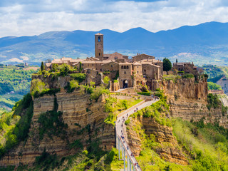 Stunning view of Civita di Bagnoregio, ghost mediaeval town built above a plateau of friable vulcanic tuff, Lazio, central Italy - obrazy, fototapety, plakaty