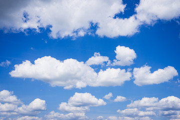 Beautiful white fluffy clouds in deep-blue sky