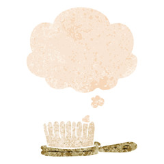 cartoon hairbrush and thought bubble in retro textured style