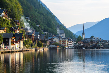 Fototapeta na wymiar Early morning in an ancient Austrian city on the shore of an Alpine lake among the mountains.