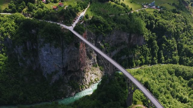 Cinematic aerial view footage of Durdevica Tara arc bridge in the mountains of Montenegro