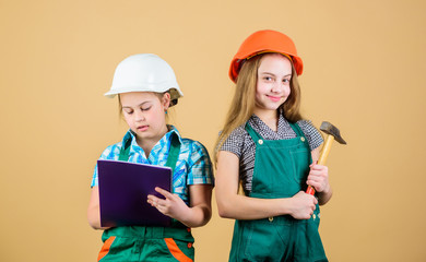 Control renovation process. Kids happy renovating home. Home improvement activity. Kids girls with tools planning renovation. Family remodeling house. Children sisters renovation their room