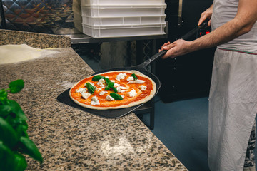 pizza chef prepares a delicious margherita pizza