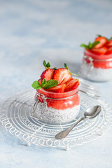 Chia Seeds Pudding with strawberries in a  glass jar. Healthy dessert. Selective