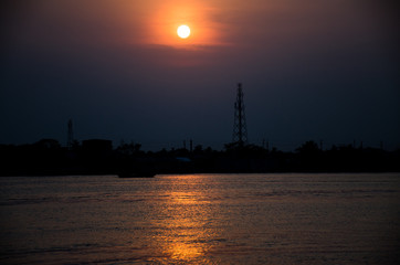River sunset over city