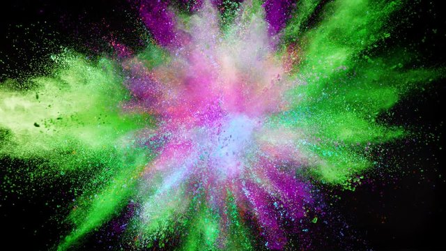 Super slow motion of coloured powder explosion isolated on black background. Filmed on high speed cinema camera, 1000fps.