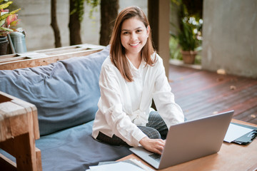 Beautiful business woman is working with her laptop computer in coffee shop