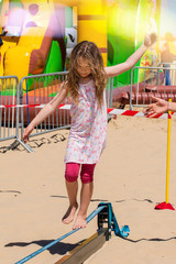 Pretty girl walking on a rope