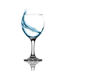 splash of water in wineglass isolated on white background.