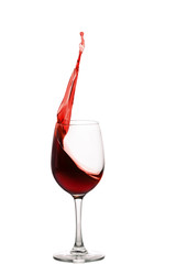 splash of red wine in glass isolated on white background.