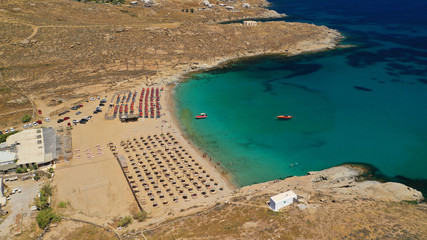Aerial drone photo of famous organised with sun beds and umbrellas beach of Lia with emerald clear...