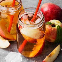 Peach ice tea on a gray background