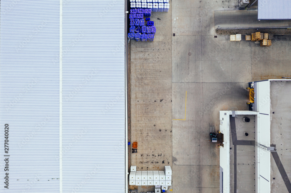 Wall mural aerial view of the distribution center, drone photography of the industrial logistic zone.