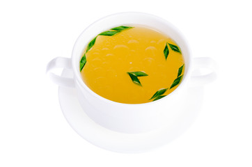 White bowl with meat broth with green onions, isolated.
