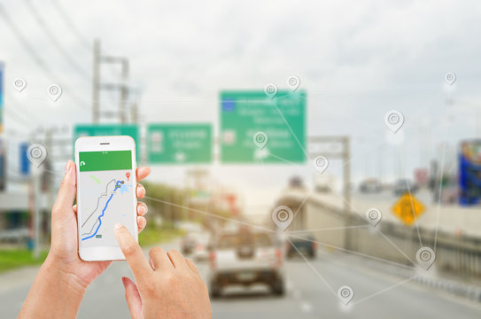 Female Hands Holding A Smart Phone Showing Part Of Navigator Map.