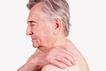 Obraz premium Senior with pain in the shoulder isolated on white