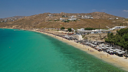 Aerial drone photo of famous organised beach of Elia with emerald clear sandy sea shore, Mykonos island, Cyclades, Greece  