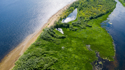  Aerial view from the drone of landscape Volga river flows among the hills and fields. The middle band of Russia.