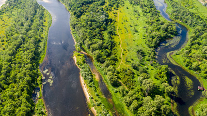  Aerial view from the drone of landscape Volga river flows among the hills and fields. The middle band of Russia.