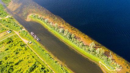  Aerial view from the drone of landscape Volga river flows among the hills and fields. The middle band of Russia.