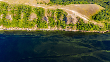  Aerial view from the drone of landscape Volga river flows among the hills and fields. The middle band of Russia.